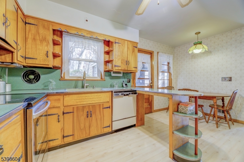 1621 Terrill Road Scotch Plains, NJ 07076 - Photo 16 of 48 a kitchen with stainless steel appliances granite countertop a stove a sink and a microwave