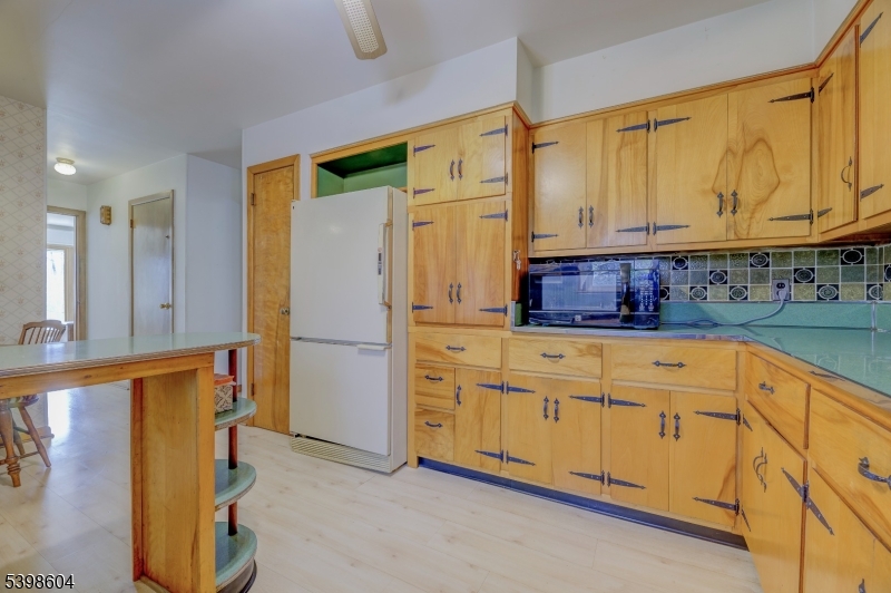 1621 Terrill Road Scotch Plains, NJ 07076 - Photo 17 of 48 a kitchen with stainless steel appliances granite countertop a refrigerator and a stove