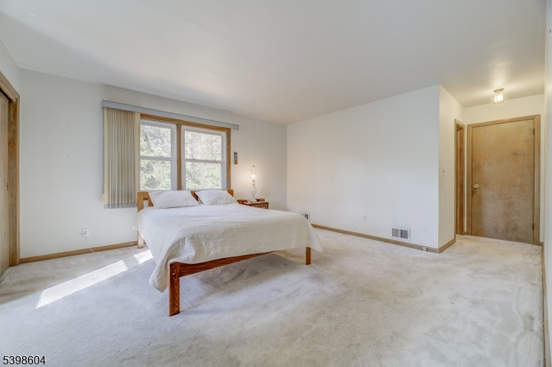 1621 Terrill Road Scotch Plains, NJ 07076 - Photo 20 of 48 a bedroom with a bed and a window