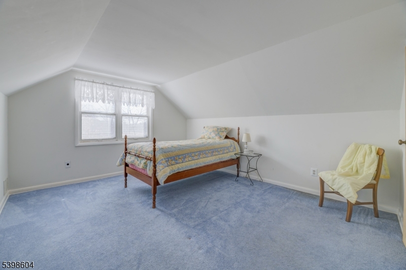1621 Terrill Road Scotch Plains, NJ 07076 - Photo 23 of 48 a bedroom with a bed chair and window