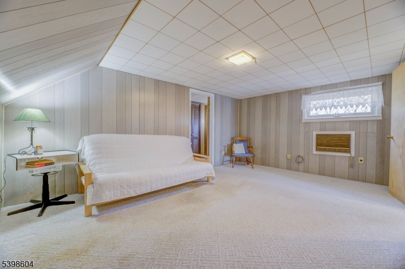 1621 Terrill Road Scotch Plains, NJ 07076 - Photo 26 of 48 a spacious bedroom with a bed and a table in it