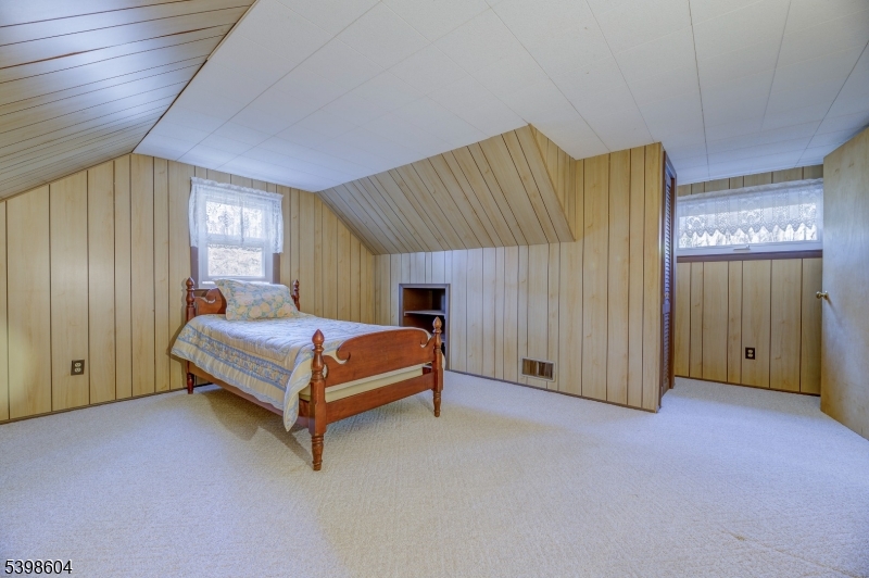 1621 Terrill Road Scotch Plains, NJ 07076 - Photo 27 of 48 a bedroom with a bed and a cabinets