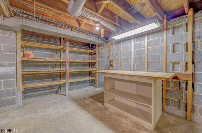 1621 Terrill Road Scotch Plains, NJ 07076 - Photo 28 of 48 a view of walk in closet with empty racks