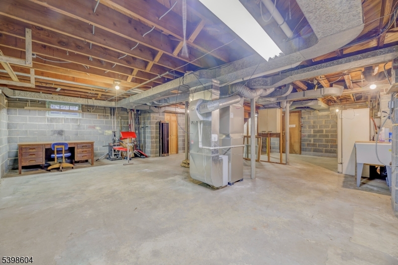 1621 Terrill Road Scotch Plains, NJ 07076 - Photo 29 of 48 a view of a garage with furniture and a garage