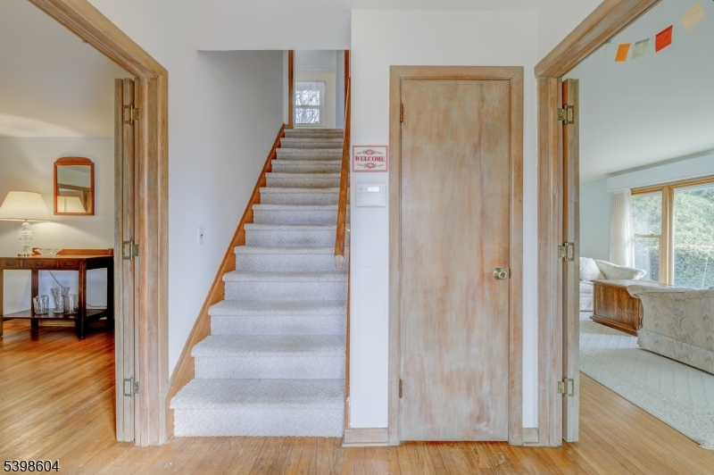 1621 Terrill Road Scotch Plains, NJ 07076 - Photo 7 of 48 a view of a hallway with wooden floor and entryway