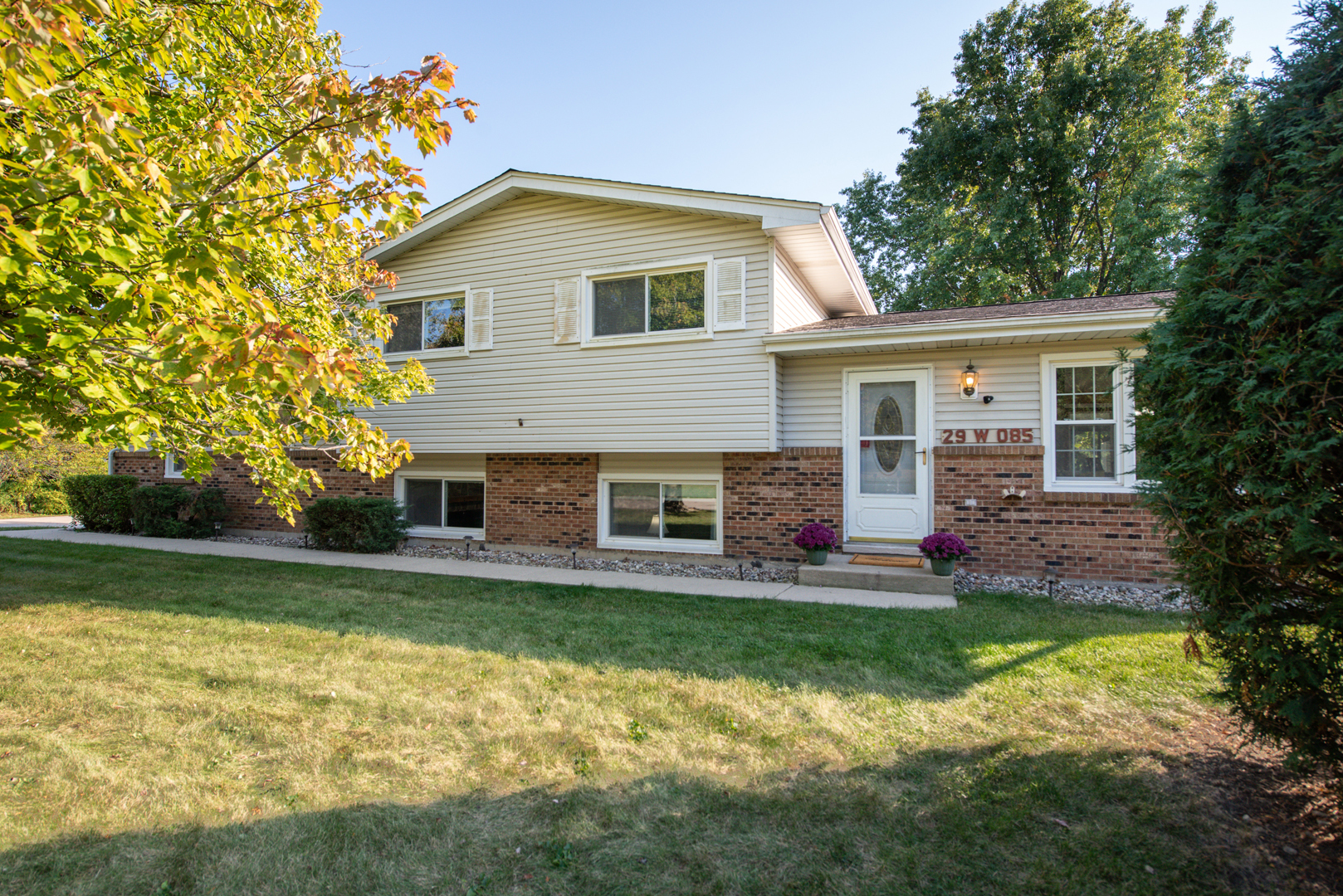 29-w085 Wagner Road Naperville, IL 60564 - Photo 1 of 18 a front view of house with yard and green space
