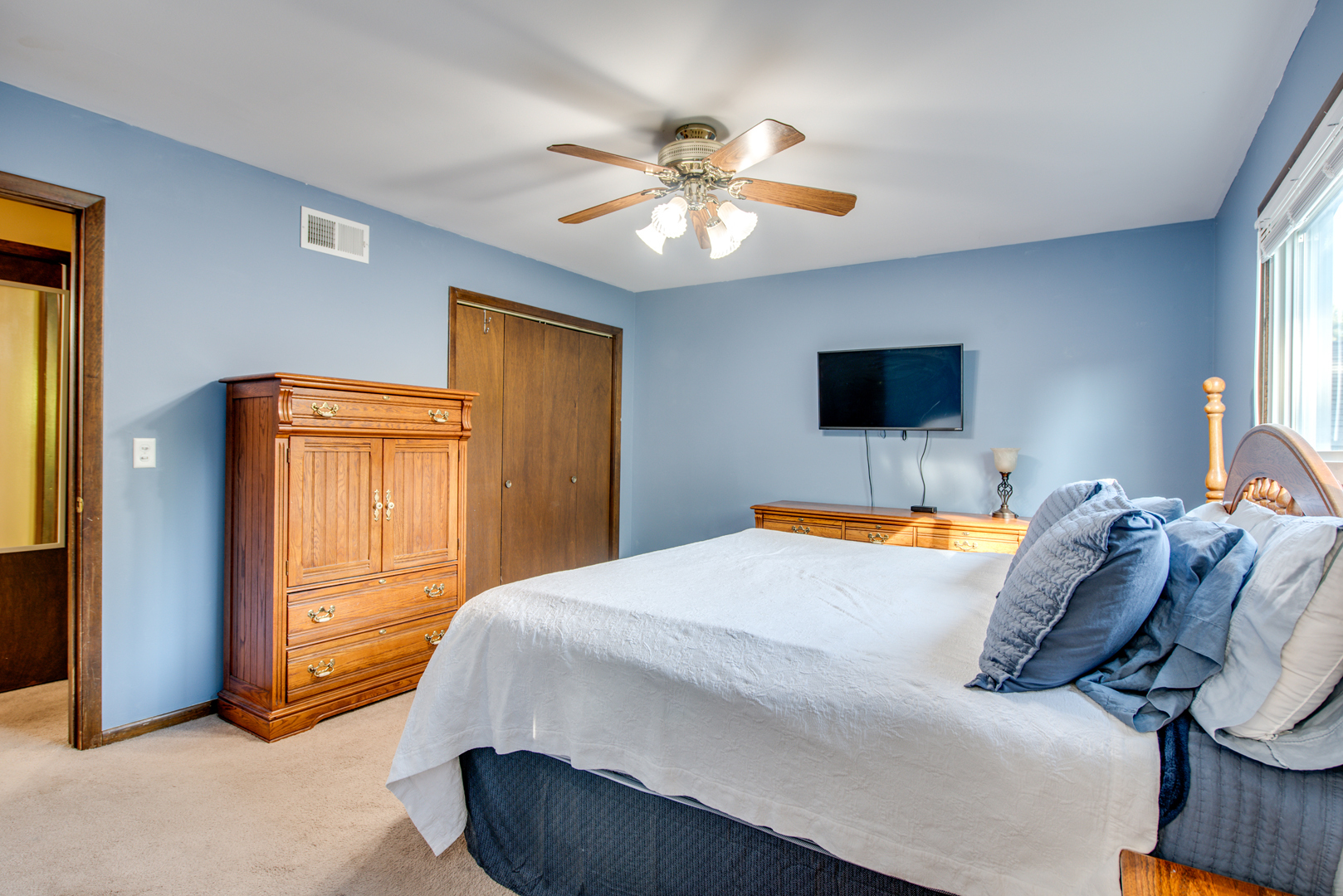 29-w085 Wagner Road Naperville, IL 60564 - Photo 12 of 18 a bedroom with a bed and a chandelier