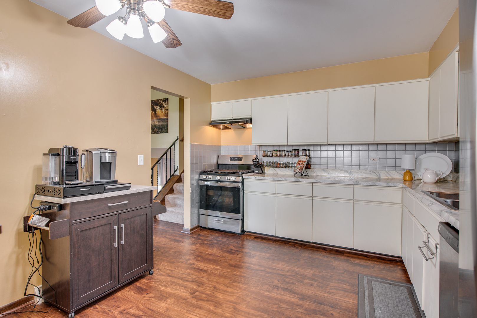 29-w085 Wagner Road Naperville, IL 60564 - Photo 7 of 18 a kitchen with stainless steel appliances granite countertop a stove and a sink