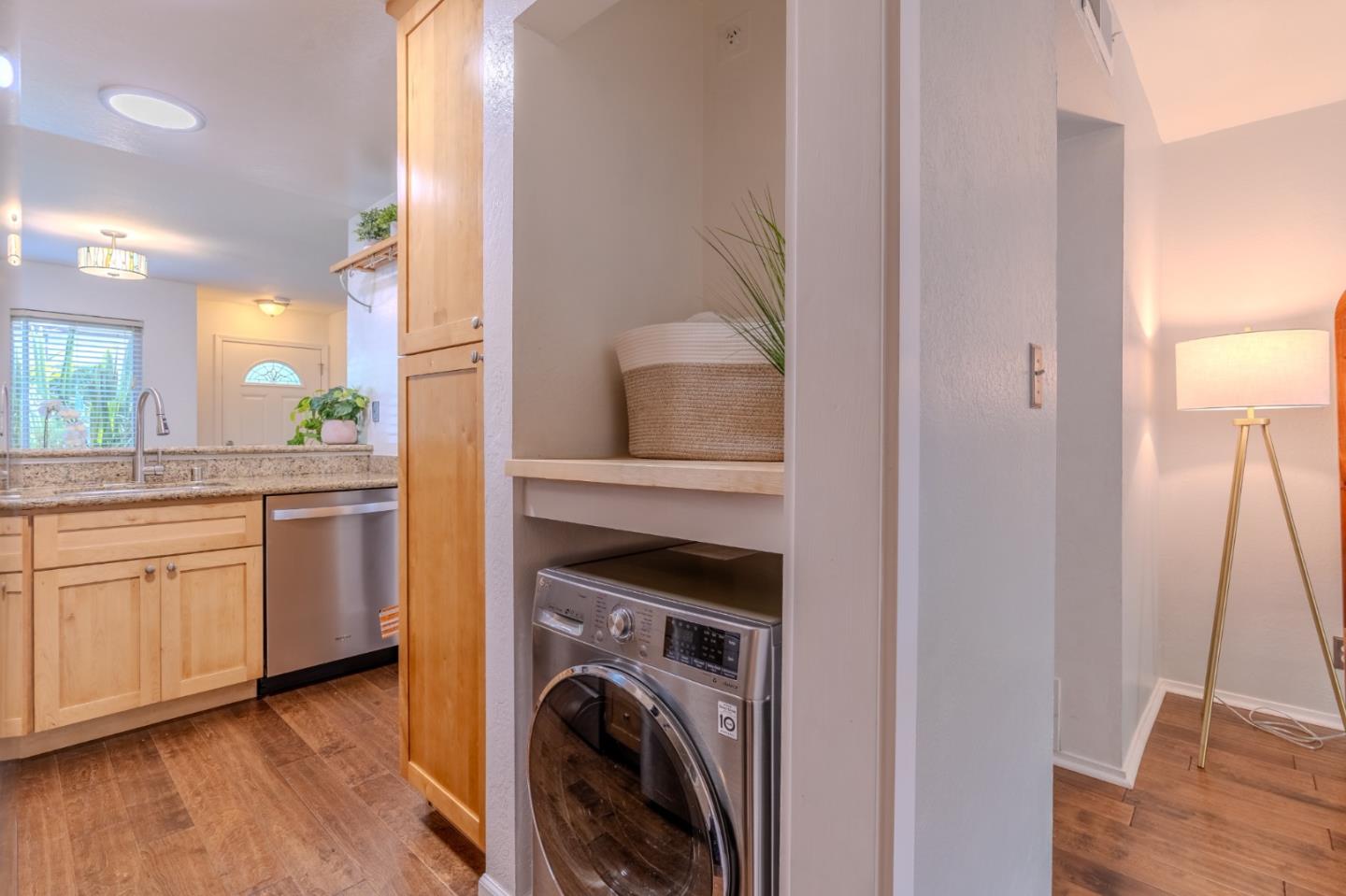 1039 Oddstad Boulevard Pacifica, CA 94044 - Photo 12 of 35 a kitchen with cabinets and wooden floor