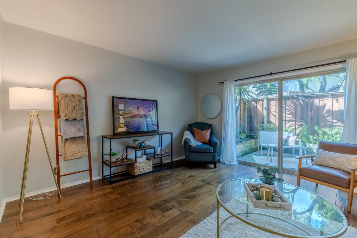1039 Oddstad Boulevard Pacifica, CA 94044 - Photo 14 of 35 a living room with furniture a window and a flat screen tv