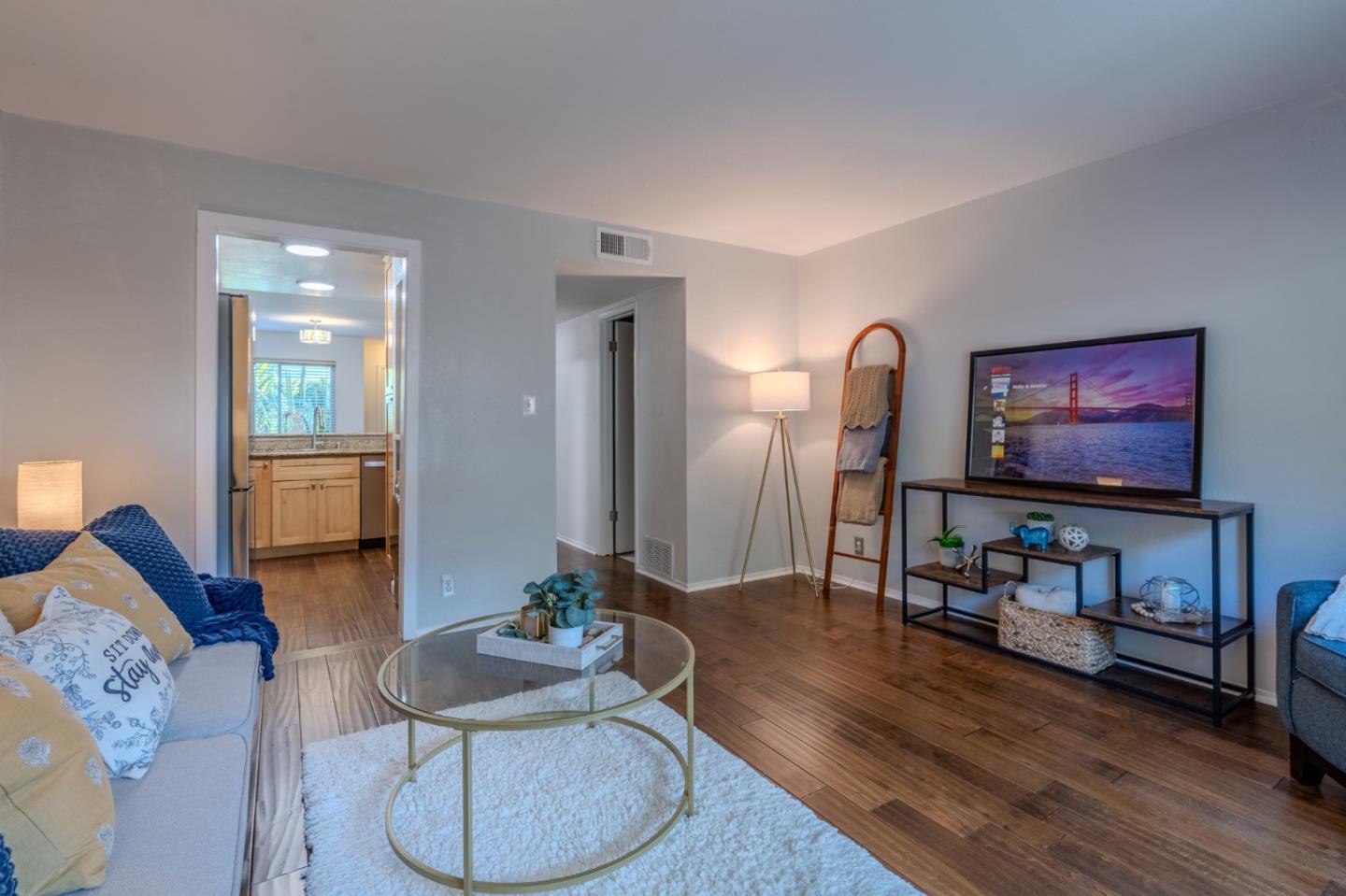 1039 Oddstad Boulevard Pacifica, CA 94044 - Photo 15 of 35 a living room with furniture and a flat screen tv
