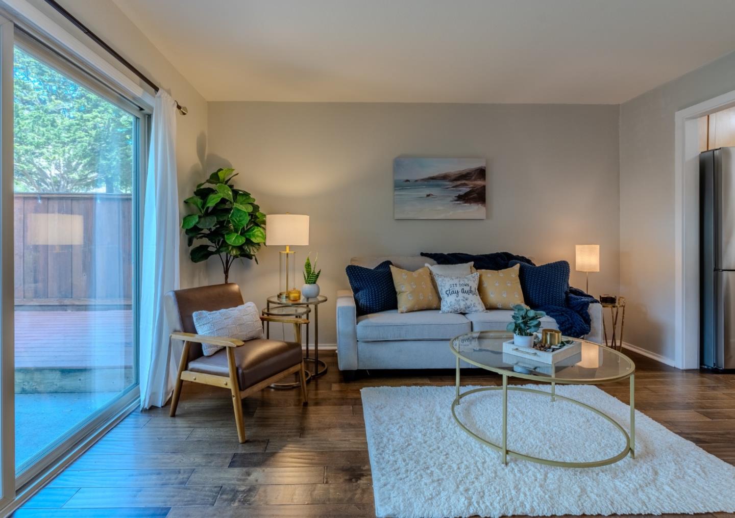 1039 Oddstad Boulevard Pacifica, CA 94044 - Photo 16 of 35 a living room with furniture potted plant and a large window
