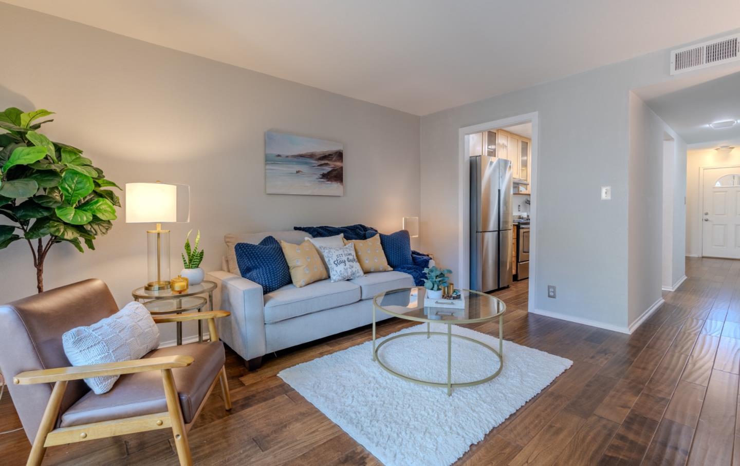 1039 Oddstad Boulevard Pacifica, CA 94044 - Photo 20 of 35 a living room with furniture and a wooden floor
