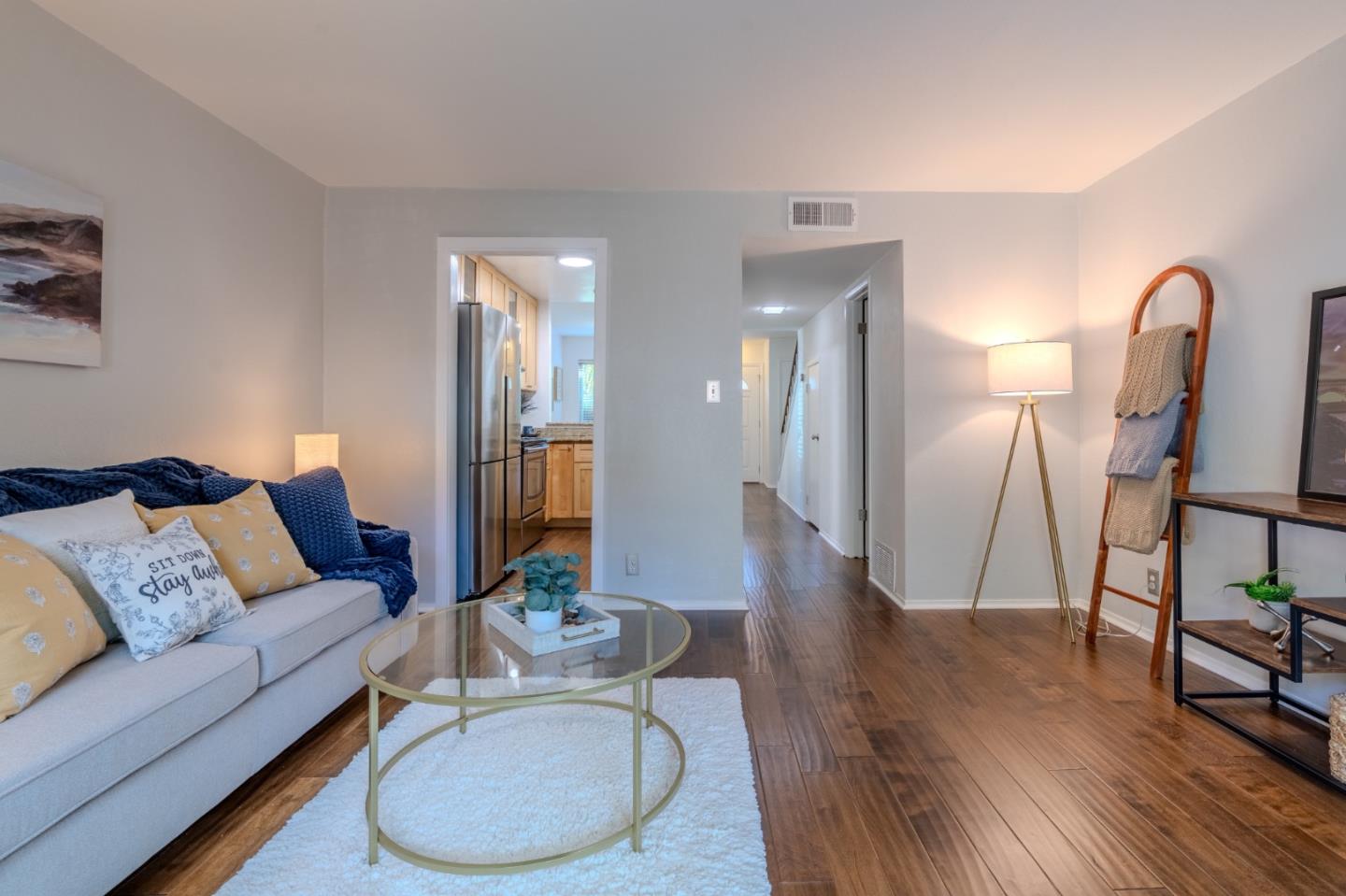 1039 Oddstad Boulevard Pacifica, CA 94044 - Photo 21 of 35 a living room with furniture and a wooden floor
