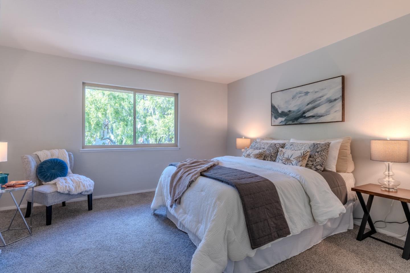 1039 Oddstad Boulevard Pacifica, CA 94044 - Photo 23 of 35 a bedroom with a bed and window