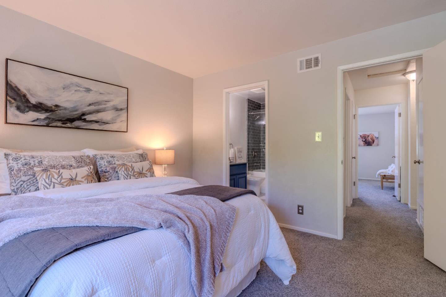 1039 Oddstad Boulevard Pacifica, CA 94044 - Photo 26 of 35 a bed room with a bed and a painting