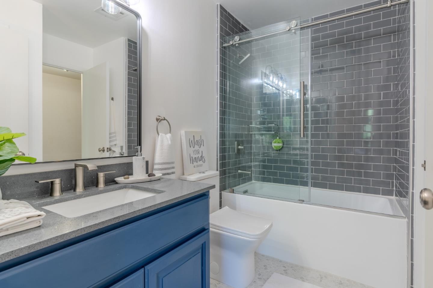 1039 Oddstad Boulevard Pacifica, CA 94044 - Photo 27 of 35 a bathroom with a sink and a mirror