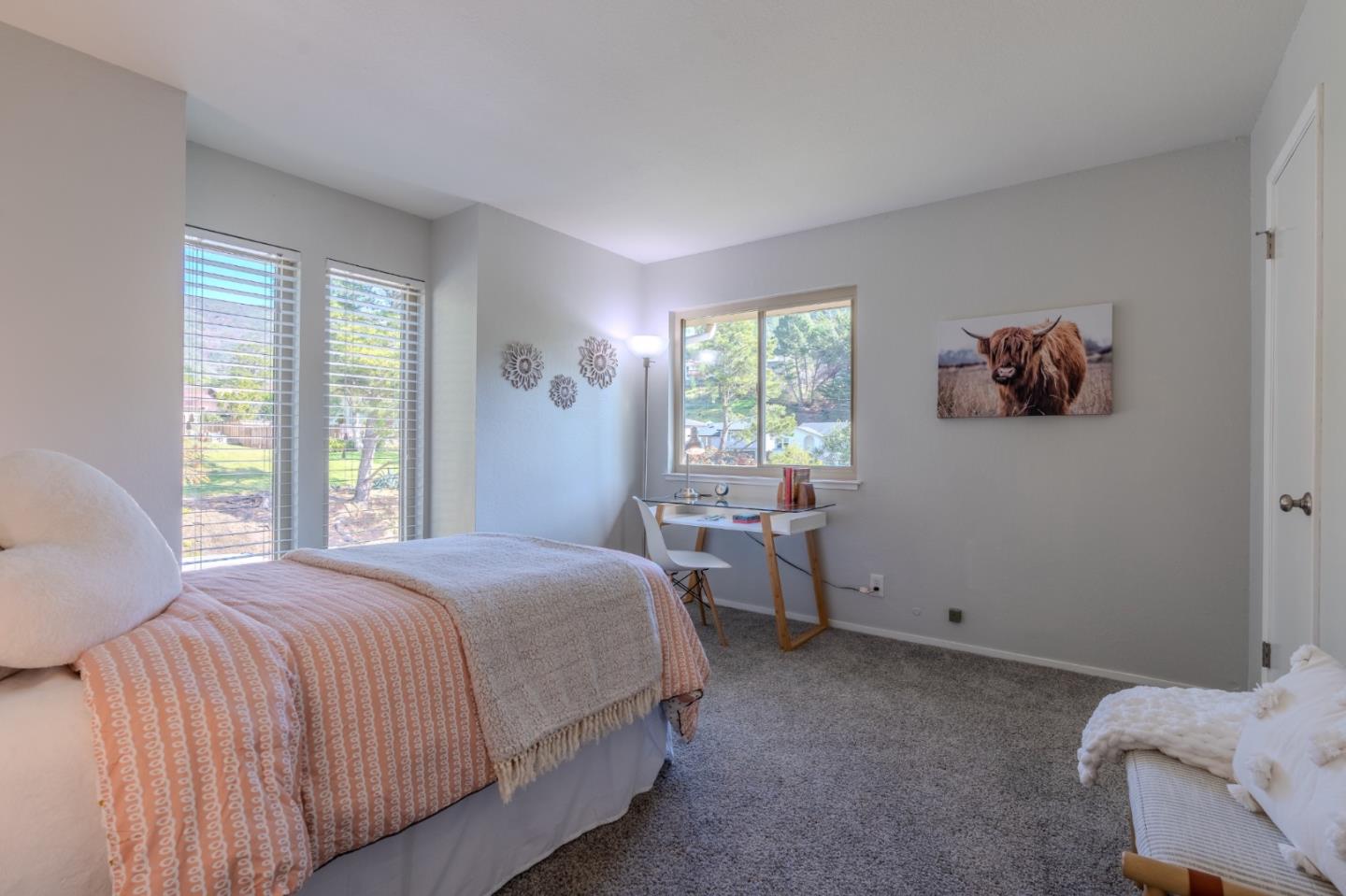 1039 Oddstad Boulevard Pacifica, CA 94044 - Photo 29 of 35 a bedroom with a bed and a window