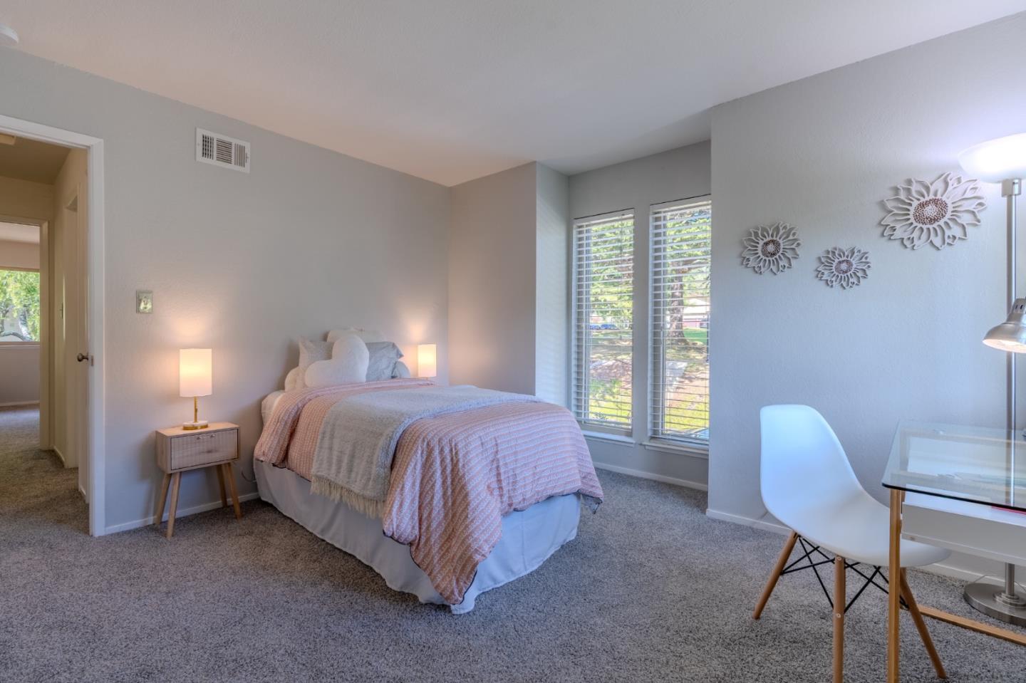 1039 Oddstad Boulevard Pacifica, CA 94044 - Photo 30 of 35 a spacious bedroom with a bed chair and a window