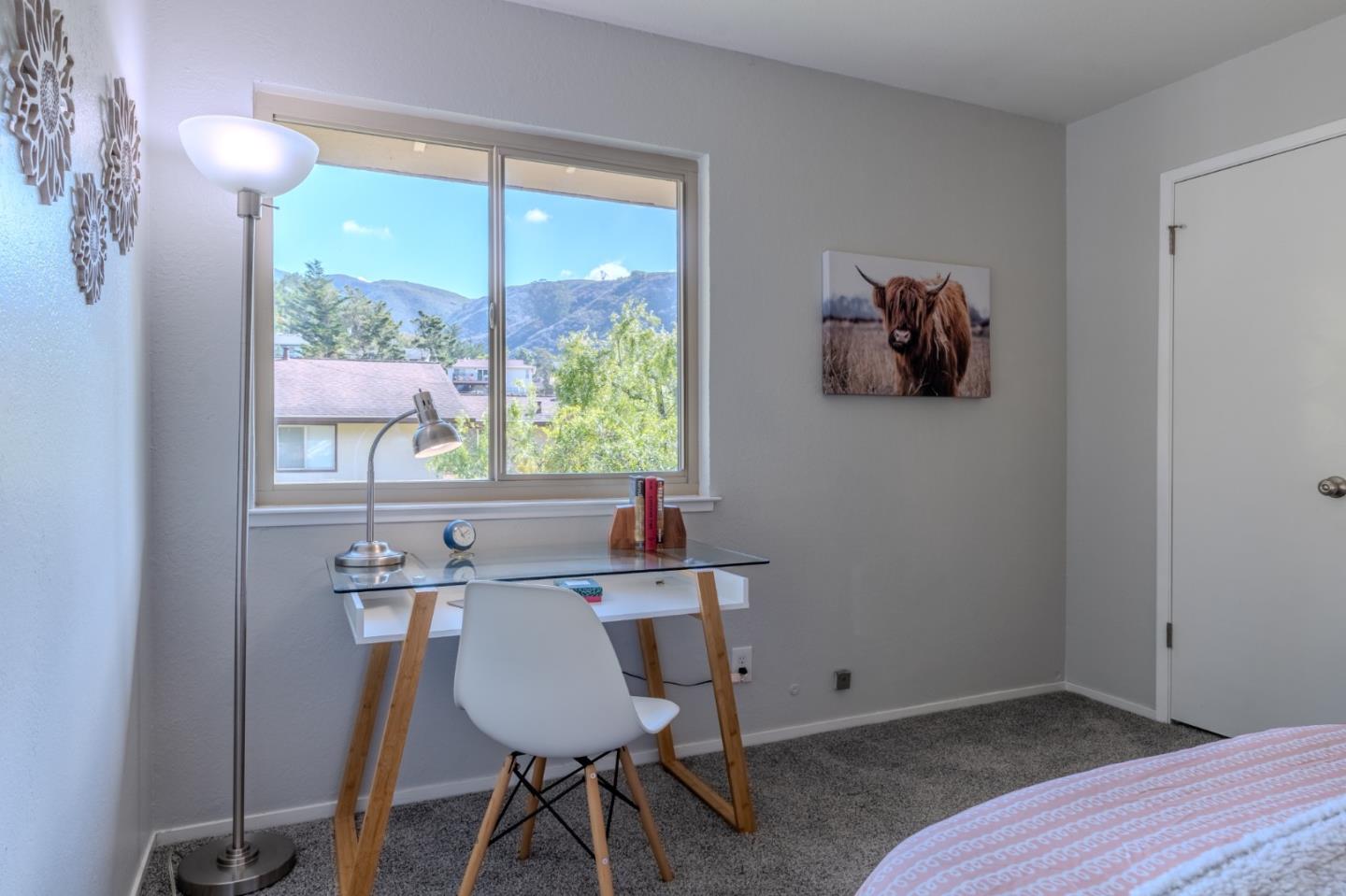 1039 Oddstad Boulevard Pacifica, CA 94044 - Photo 31 of 35 a view of a workspace with furniture and a window