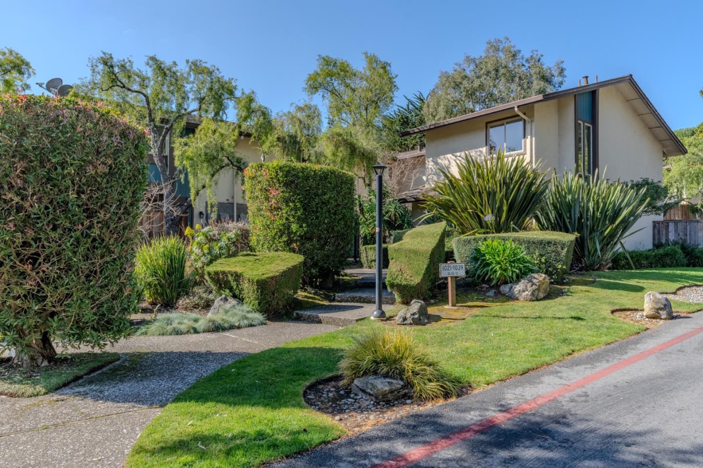 1039 Oddstad Boulevard Pacifica, CA 94044 - Photo 34 of 35 a front view of a house with garden