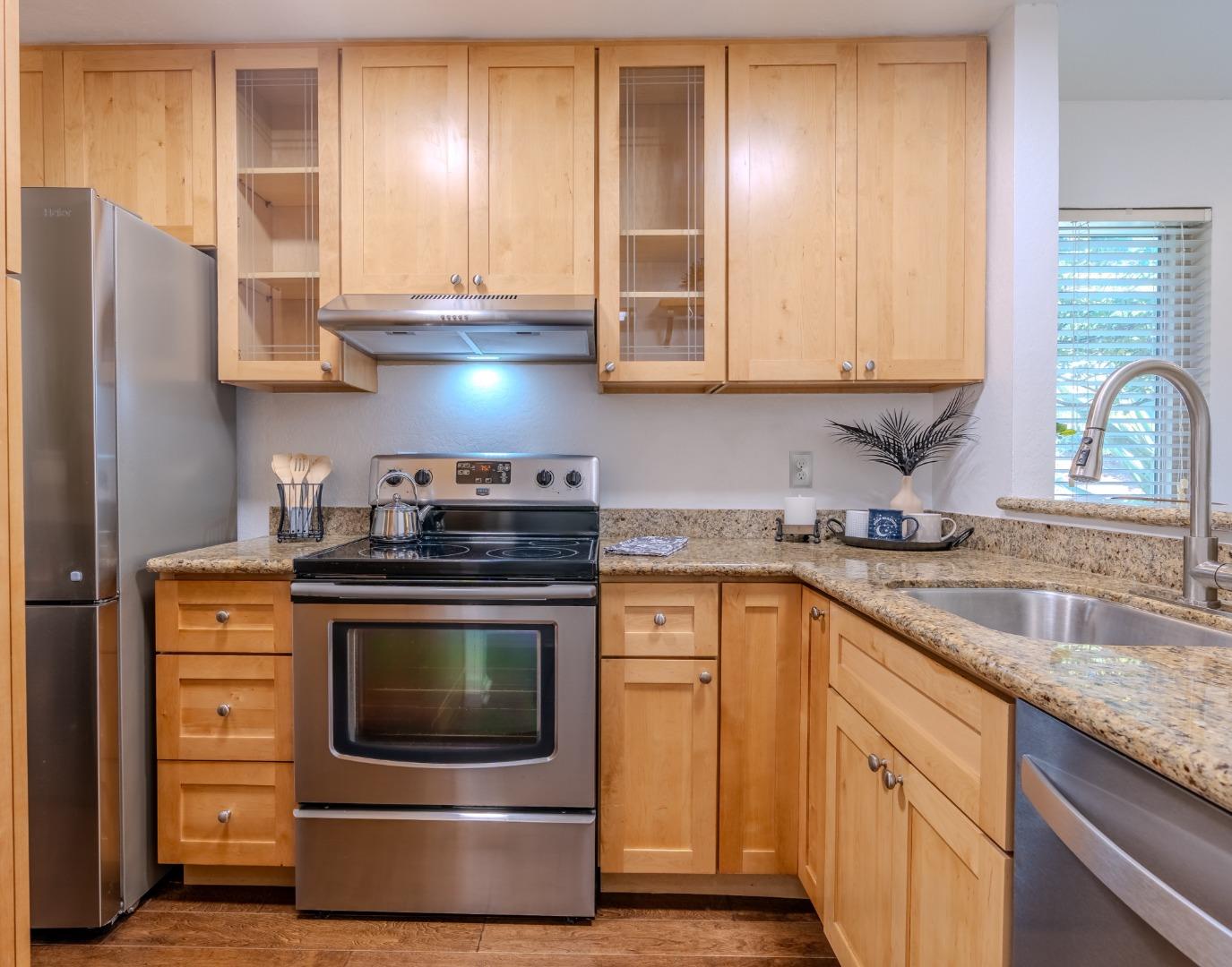 1039 Oddstad Boulevard Pacifica, CA 94044 - Photo 8 of 35 a kitchen with granite countertop a stove and a sink
