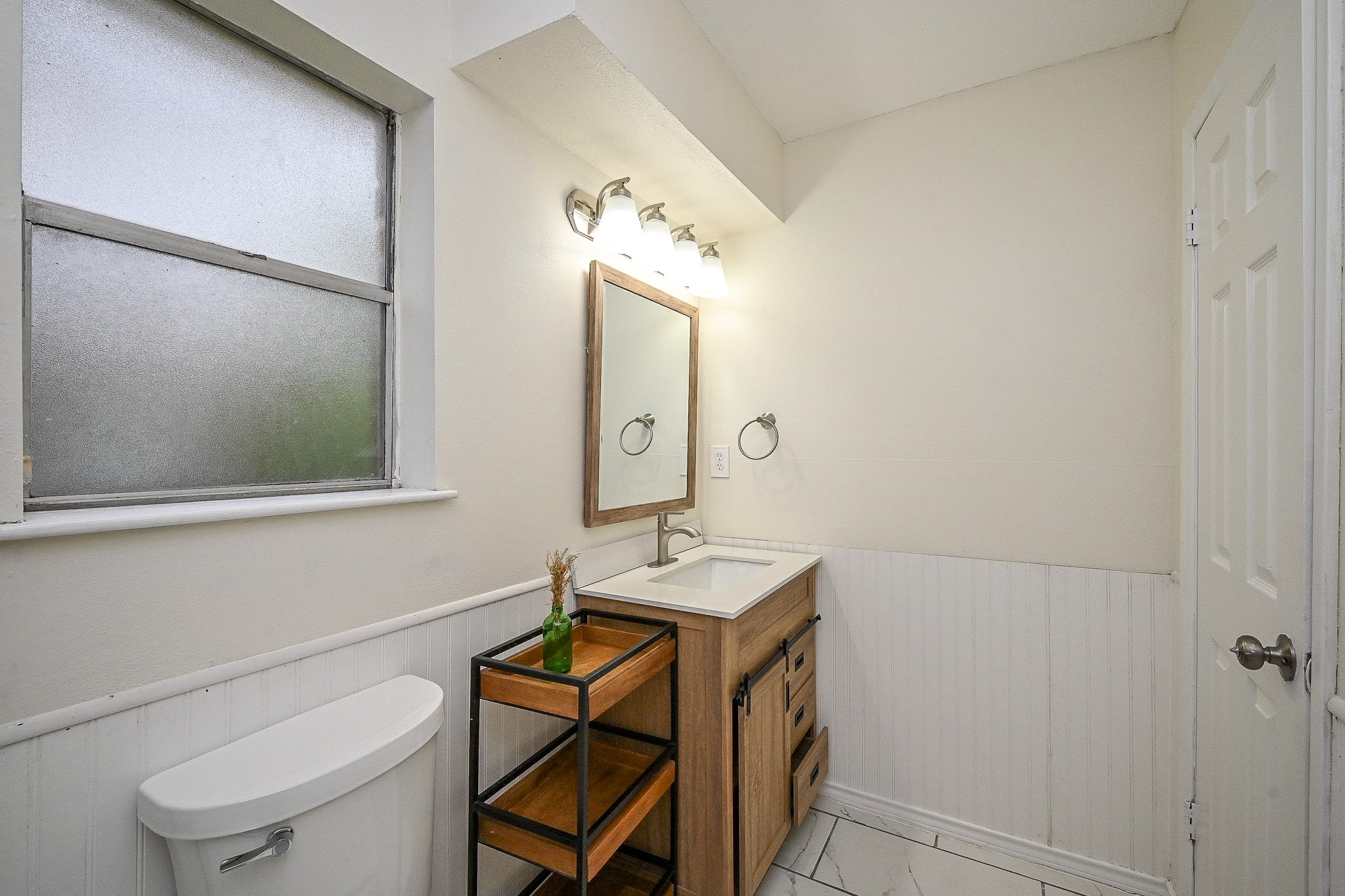 23814 Spring Gum Drive Spring, TX 77373 - Photo 18 of 21 a bathroom with a sink a mirror and a toilet