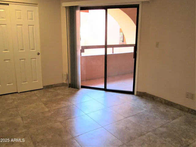 an empty room with large window