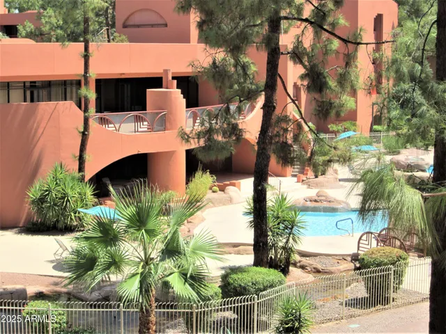a view of a swimming pool with lounge chairs