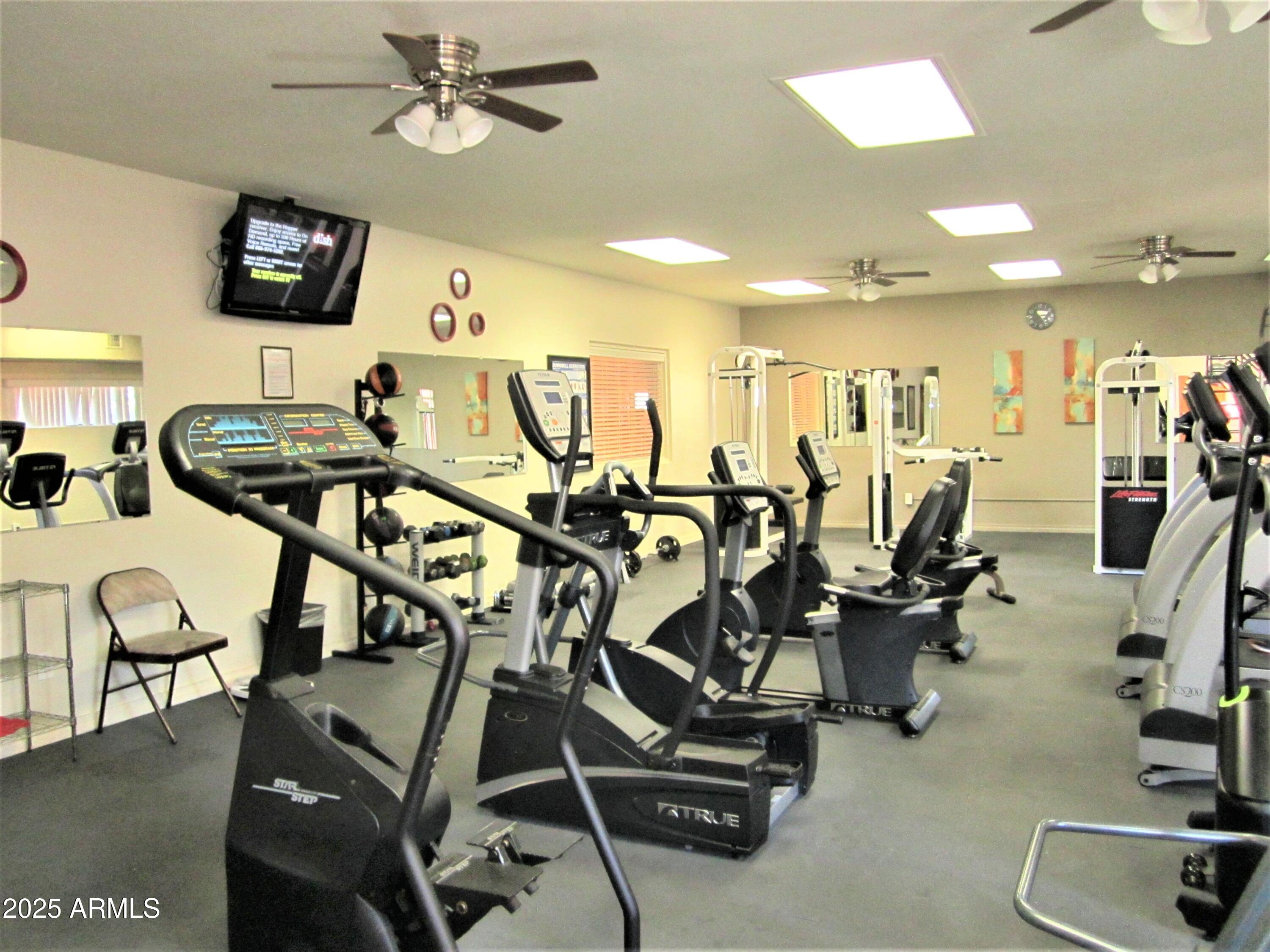 4303 East Cactus Road, Unit 310 Phoenix, AZ 85032 - Photo 22 of 27 a view of a room with gym equipment
