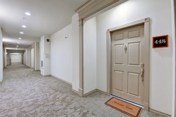 a view of a hallway with closet area