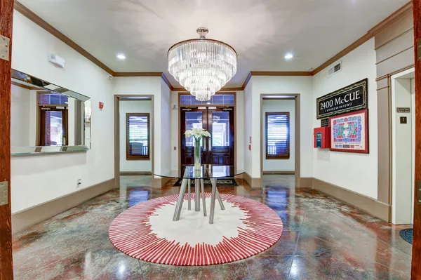 a view of a livingroom with furniture window and wooden floor