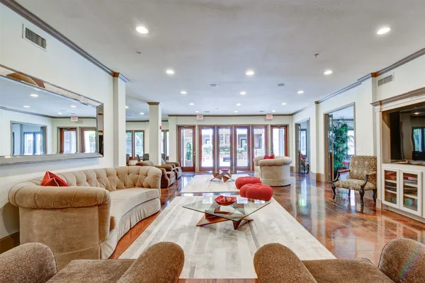 a living room with furniture and a large window
