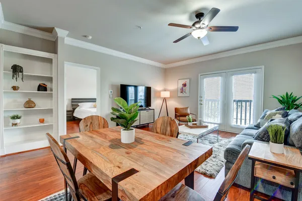 a view of a dining room with furniture window and wooden floor
