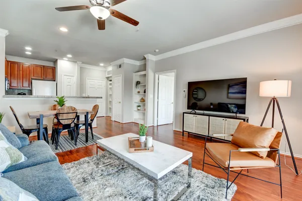 a living room with furniture and a flat screen tv