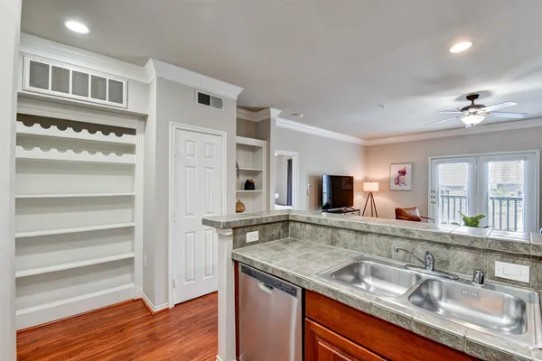 a view of living room with granite countertop furniture and fireplace