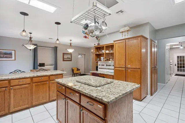 a kitchen with stainless steel appliances granite countertop a sink and cabinets