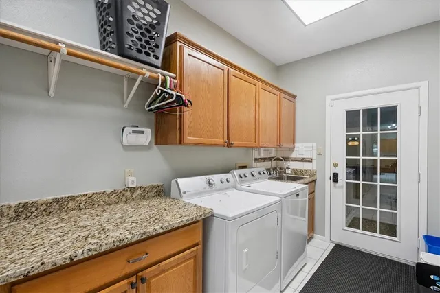 a work room with furniture and a potted plant