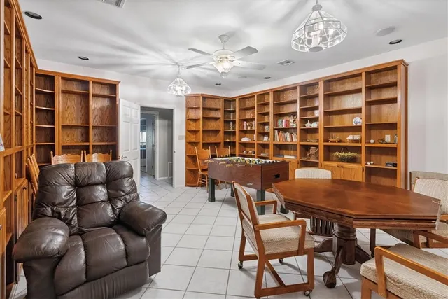 a view of a livingroom with workspace and a window