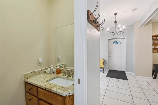 a bedroom with a bed and a lamp