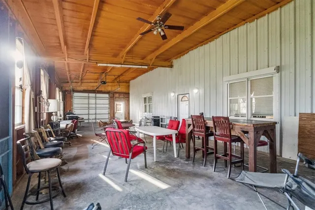 a living room with furniture or couch and a chandelier