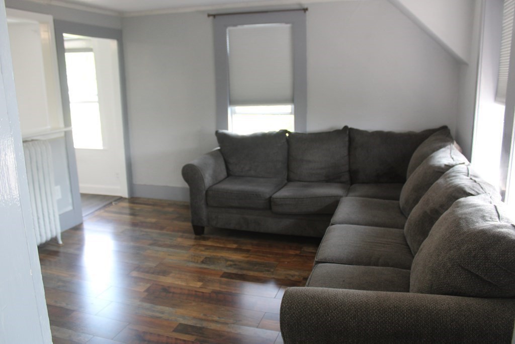 118 Eastern Avenue Gloucester, MA 01930 - Photo 12 of 40 a living room with furniture and a window