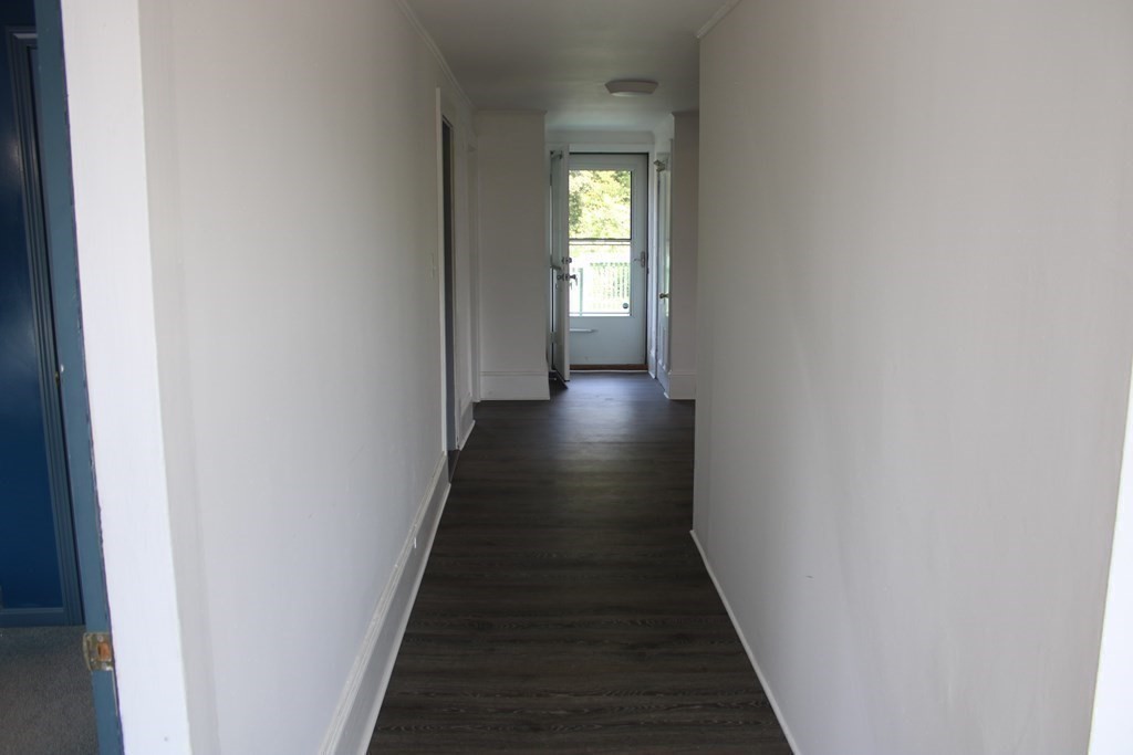 118 Eastern Avenue Gloucester, MA 01930 - Photo 13 of 40 a view of a hallway with wooden floor and staircase