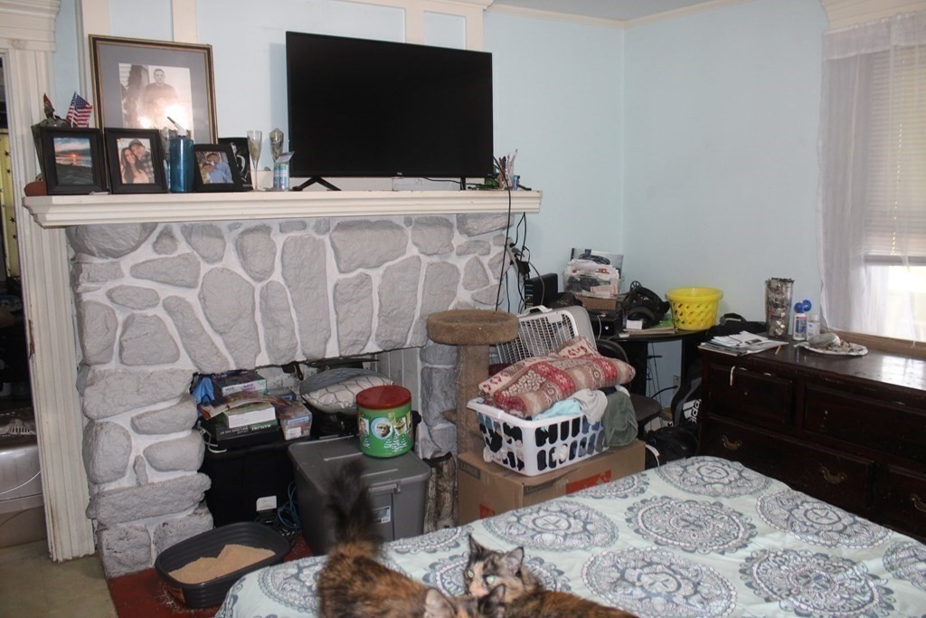 118 Eastern Avenue Gloucester, MA 01930 - Photo 30 of 40 a living room with furniture and a flat screen tv