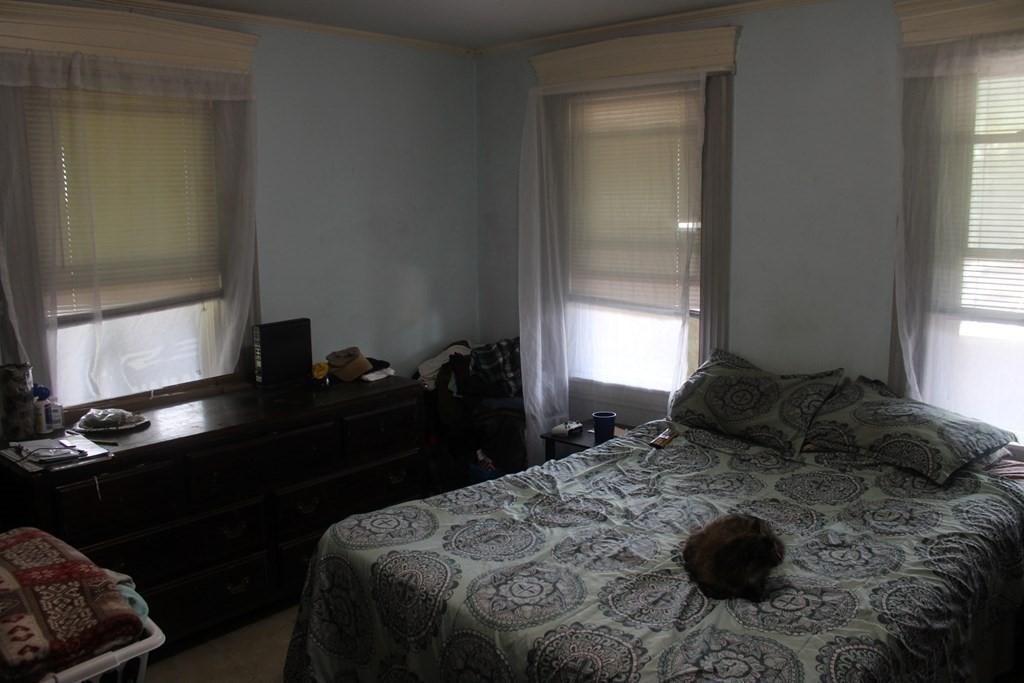 118 Eastern Avenue Gloucester, MA 01930 - Photo 31 of 40 a bedroom with a bed and window