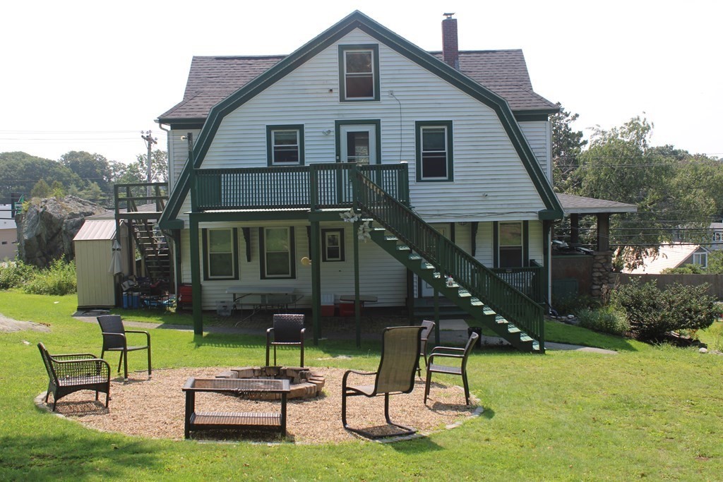 118 Eastern Avenue Gloucester, MA 01930 - Photo 35 of 40 a front view of a house with a yard