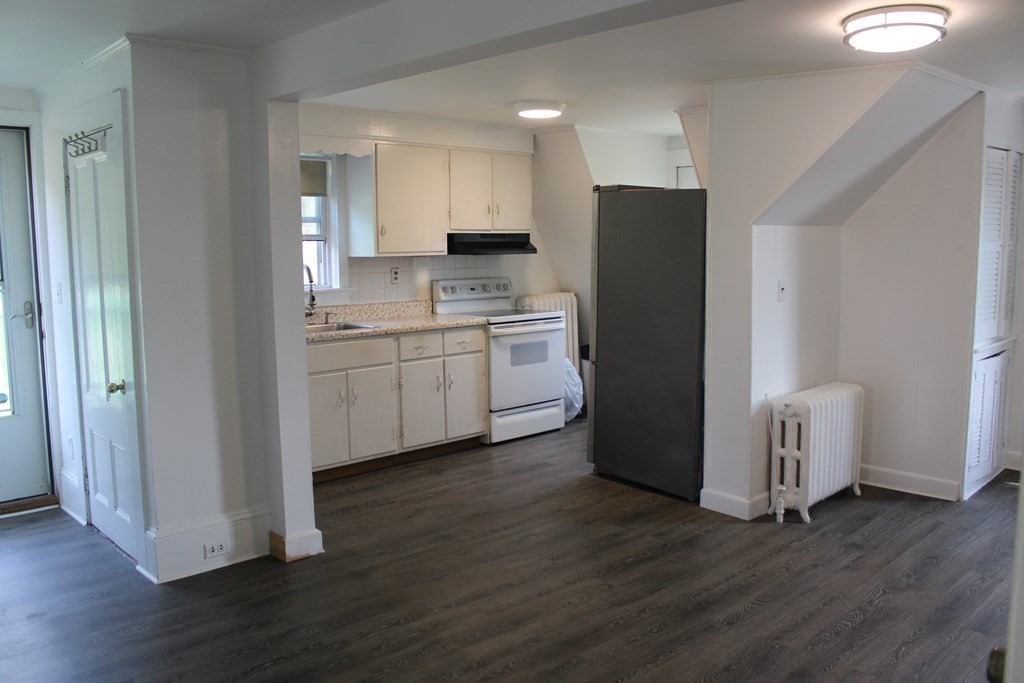 118 Eastern Avenue Gloucester, MA 01930 - Photo 10 of 40 a kitchen with a refrigerator and a sink