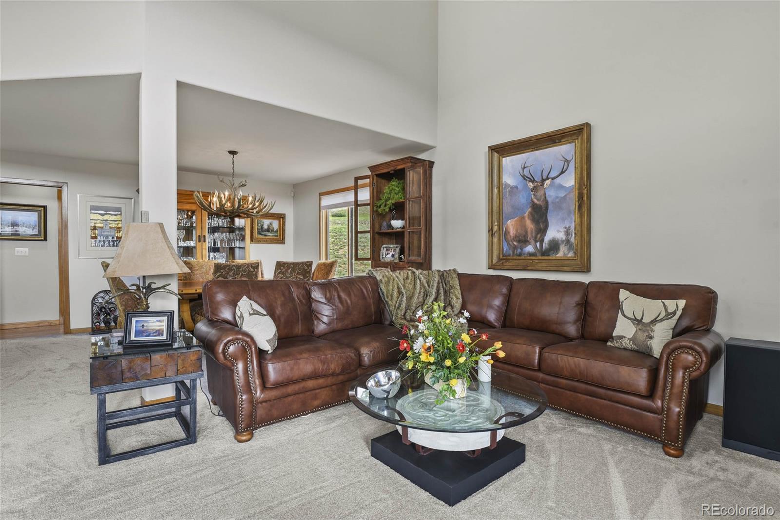 386 Monte Vista Road Golden, CO 80401 - Photo 12 of 32 a living room with furniture ceiling fan and a window