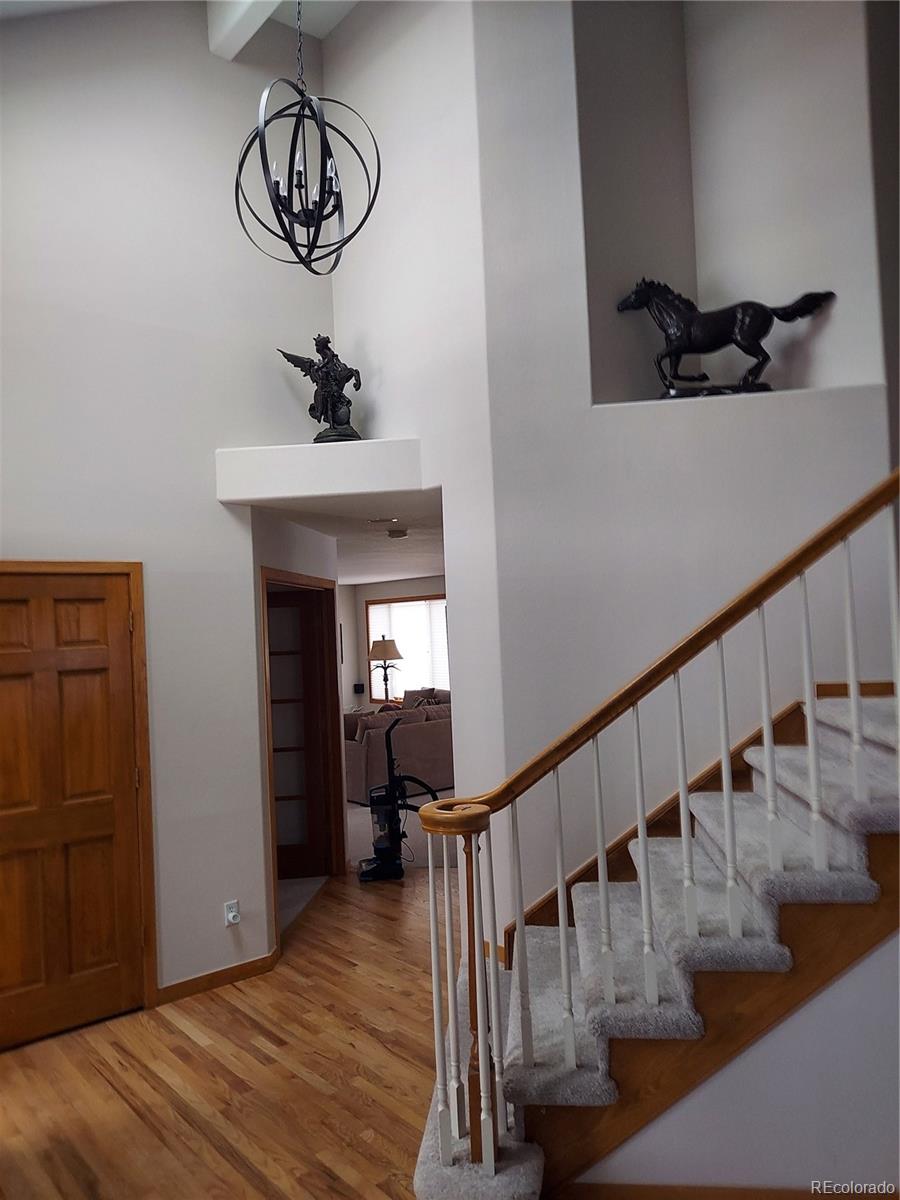 386 Monte Vista Road Golden, CO 80401 - Photo 14 of 32 a view of entryway and hall with wooden floor