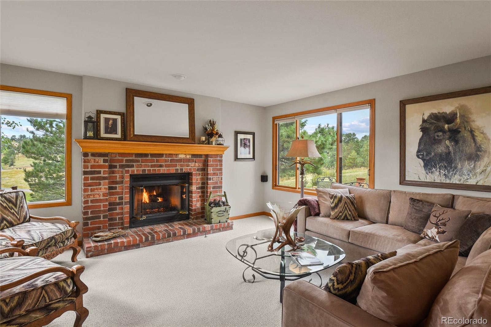 386 Monte Vista Road Golden, CO 80401 - Photo 17 of 32 a living room with furniture and a fireplace